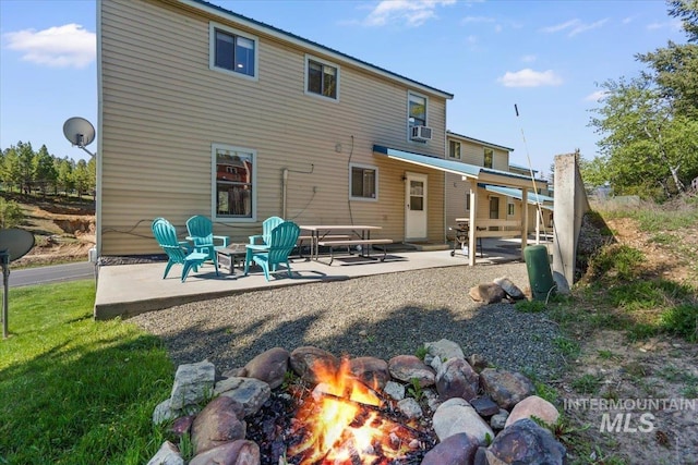 502 Lake Cascade Pkwy Unit 6, Cascade, ID 83611 - rear view of property with a patio, an outdoor fire pit, and cooling unit