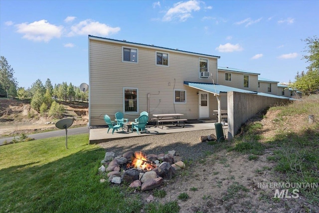502 Lake Cascade Pkwy Unit 6, Cascade, ID 83611 - rear view of house with an outdoor fire pit, a patio, and a yard