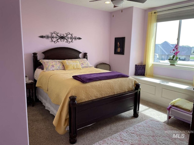 carpeted bedroom with a ceiling fan