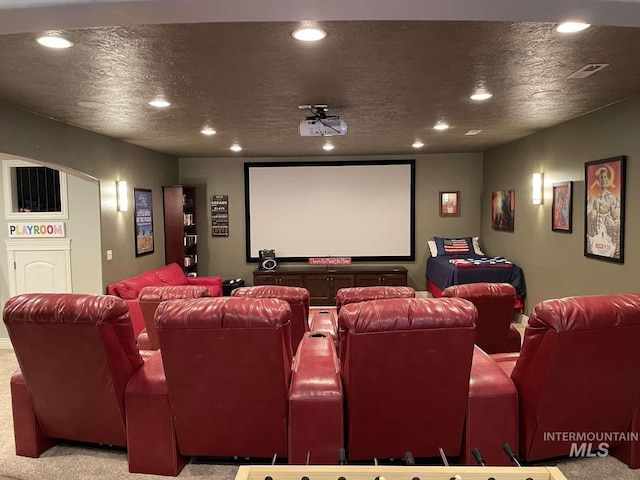 home theater with recessed lighting, visible vents, and a textured ceiling