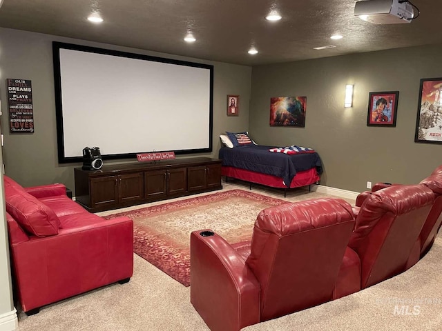 home theater with carpet flooring, recessed lighting, a textured ceiling, and baseboards