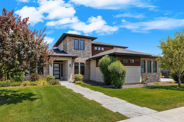 prairie-style home with stone siding and a front lawn