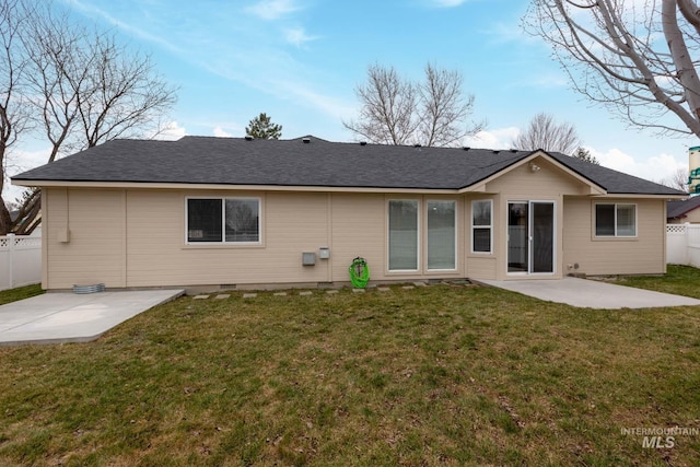 back of property featuring crawl space, fence, a yard, and a patio area