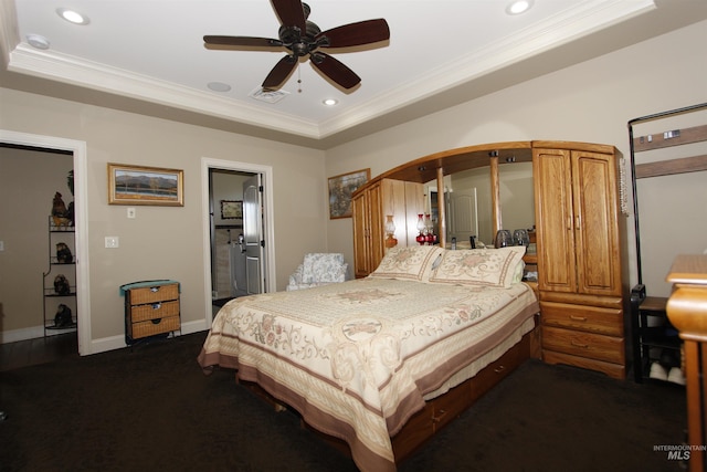 bedroom with visible vents, ornamental molding, a tray ceiling, and recessed lighting
