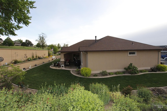 view of yard with fence and a patio area