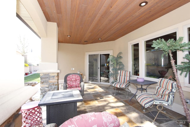 view of patio / terrace with a fire pit