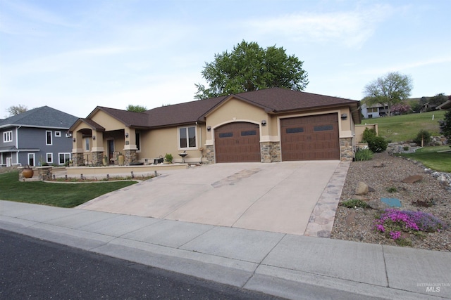 ranch-style home featuring a garage, stucco siding, stone siding, and concrete driveway