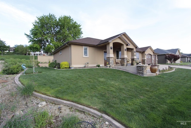 view of front facade featuring a front lawn and stucco siding