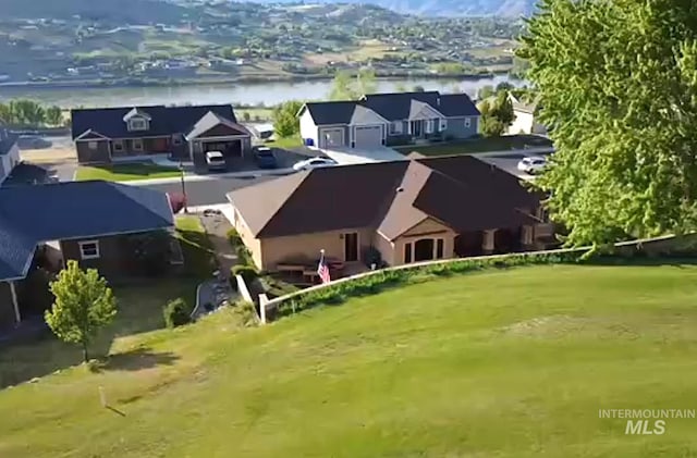drone / aerial view featuring a water view