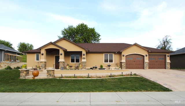 view of front facade with a garage, a front lawn, stone siding, stucco siding, and driveway