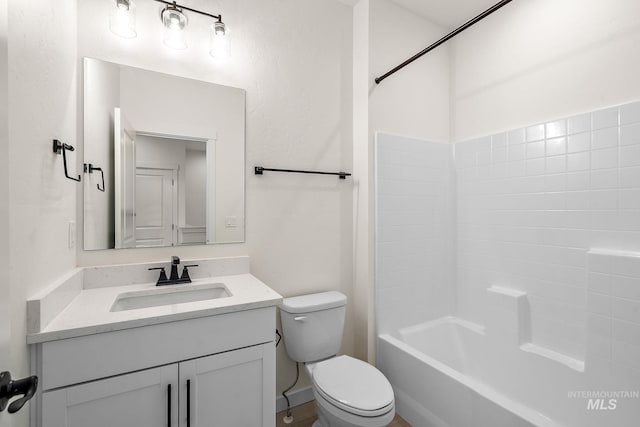 full bathroom featuring toilet, shower / bathtub combination, and vanity