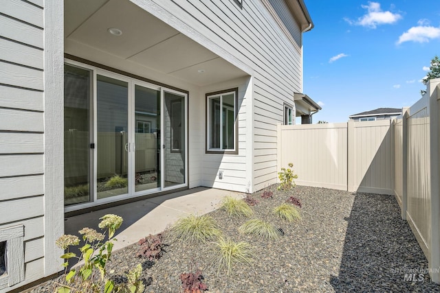 exterior space featuring a patio area and fence