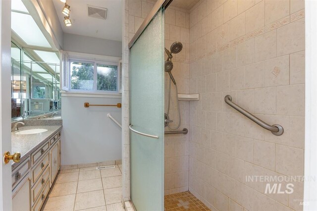 1605 Vineyard Dr, Lewiston, ID 83501 - bathroom featuring a shower stall, vanity, and tile patterned flooring
