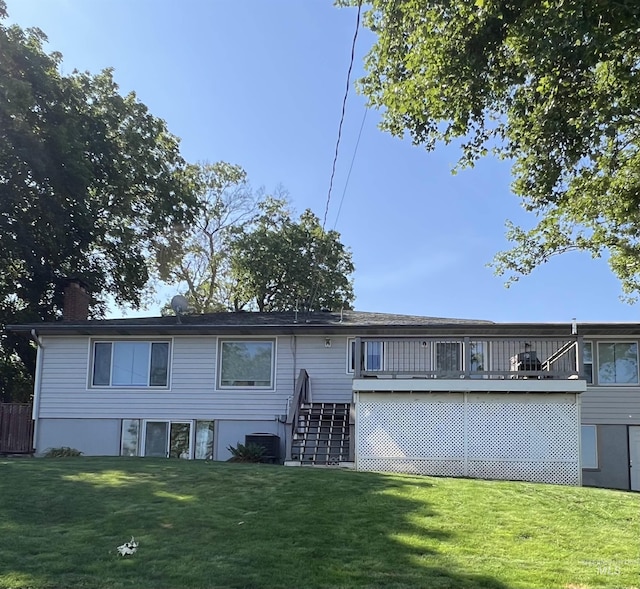 1605 Vineyard Dr, Lewiston, ID 83501 - back of property featuring a lawn, stairway, a deck, and a chimney