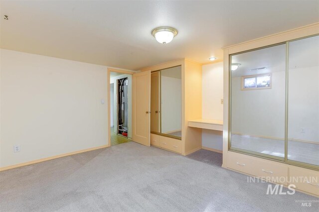 1605 Vineyard Dr, Lewiston, ID 83501 - unfurnished bedroom with light colored carpet and multiple closets