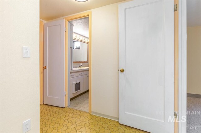 1605 Vineyard Dr, Lewiston, ID 83501 - hallway with a sink and light flooring