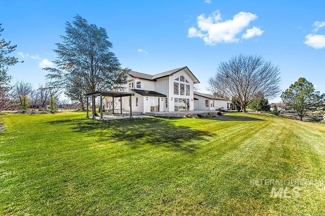 view of home's exterior with a yard and a patio