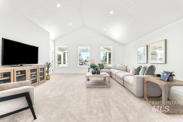 carpeted living area with high vaulted ceiling, recessed lighting, a textured ceiling, and baseboards