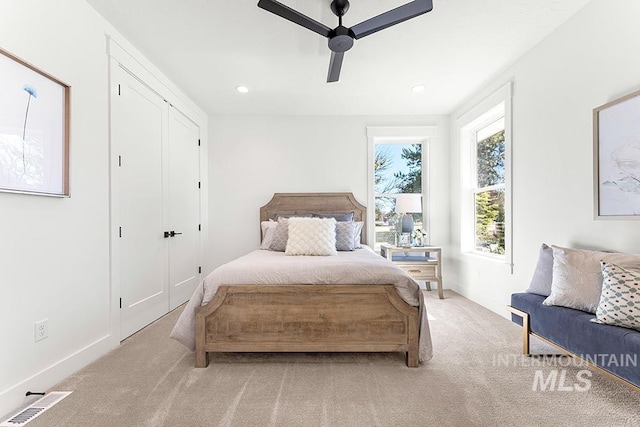 carpeted bedroom with recessed lighting, visible vents, ceiling fan, and baseboards