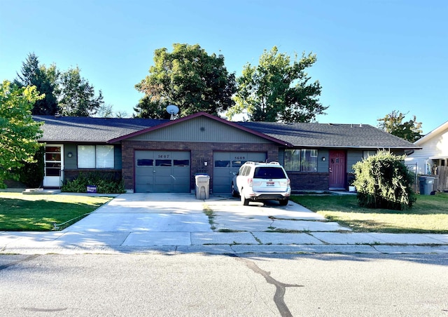 ranch-style house featuring a garage and a front yard