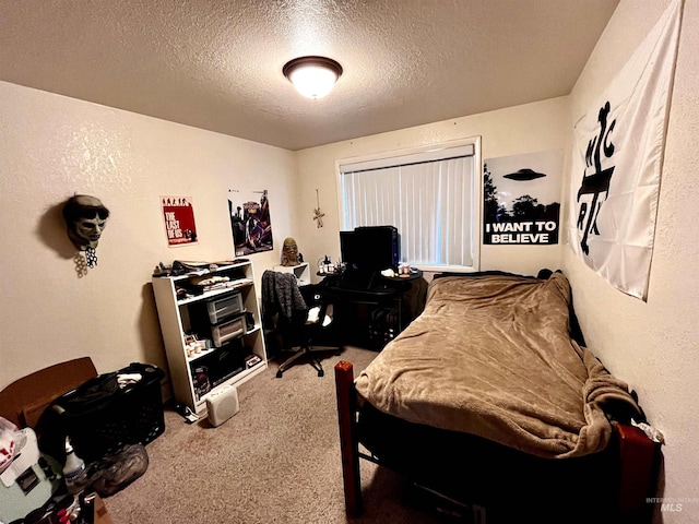 carpeted bedroom with a textured ceiling