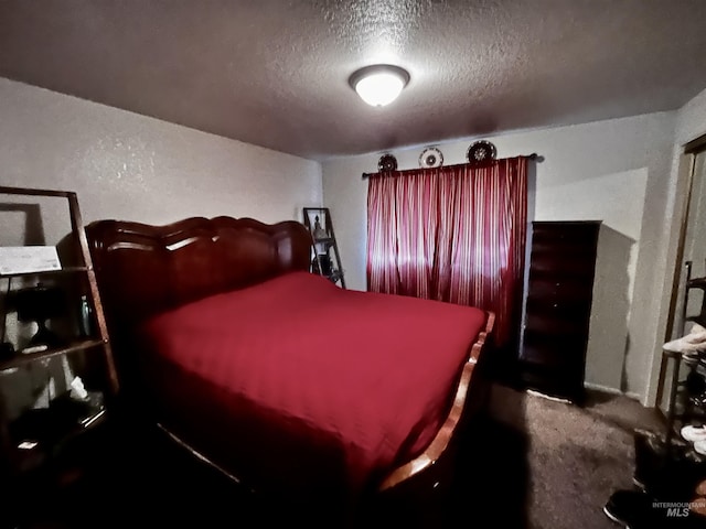 carpeted bedroom with a textured ceiling