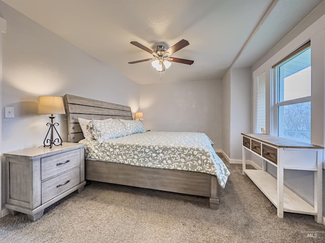 carpeted bedroom with baseboards and a ceiling fan