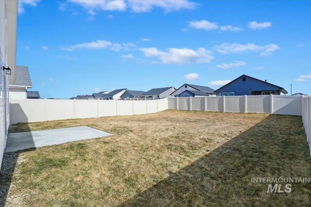 view of yard featuring a fenced backyard and a patio