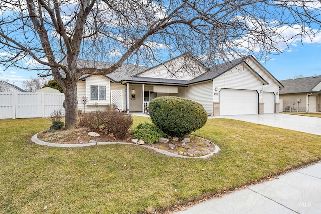 view of front of house with brick siding, concrete driveway, an attached garage, fence, and a front lawn