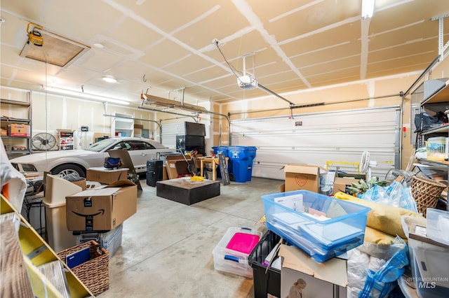 garage featuring a garage door opener