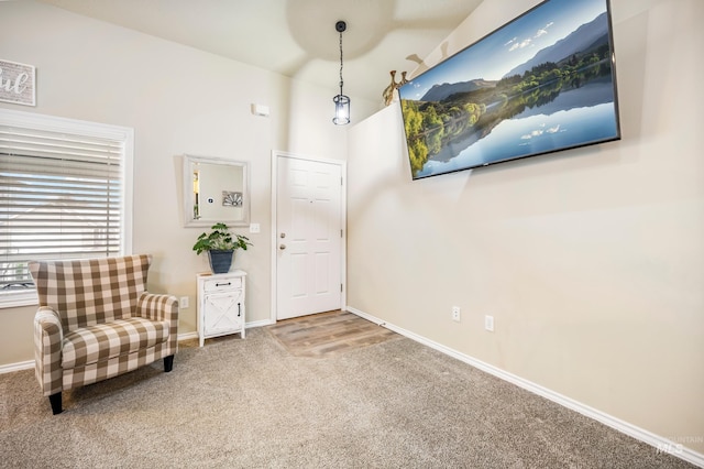 entryway featuring carpet floors and baseboards