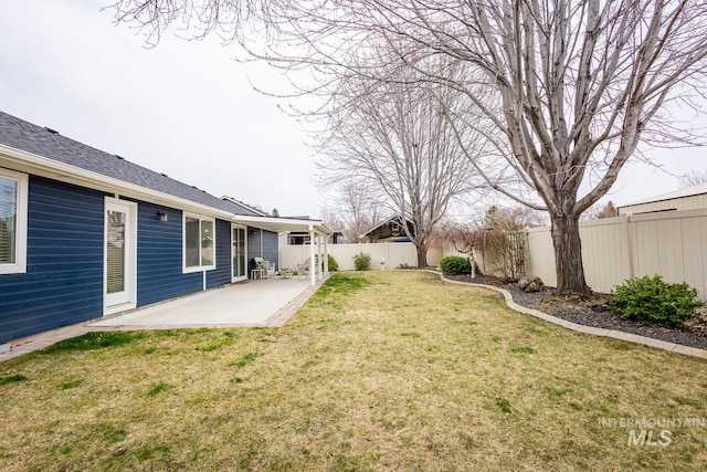 view of yard featuring a patio area and a fenced backyard