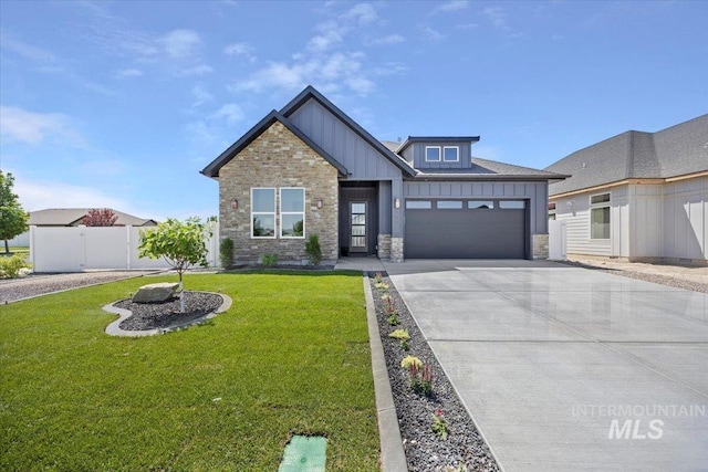 507 Falling Leaf Ln, Twin Falls, ID 83301 - view of front of house with board and batten siding, an attached garage, stone siding, and concrete driveway