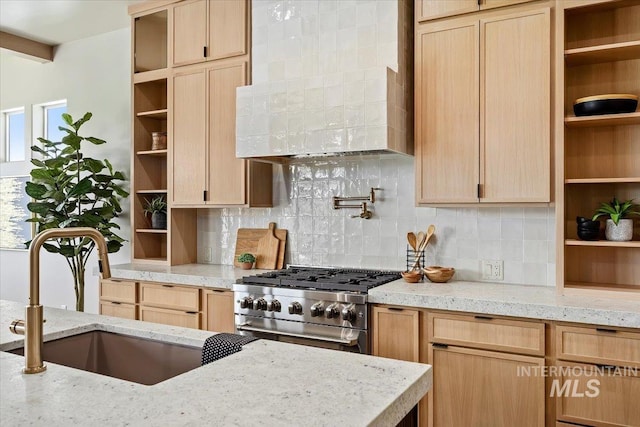 507 Falling Leaf Ln, Twin Falls, ID 83301 - kitchen with open shelves, high end stove, light brown cabinets, premium range hood, and decorative backsplash