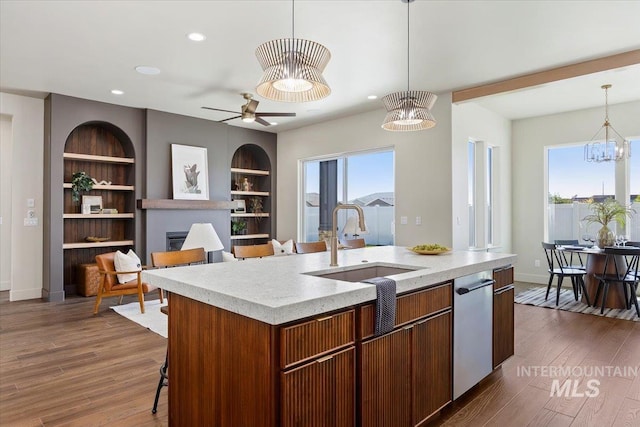 507 Falling Leaf Ln, Twin Falls, ID 83301 - kitchen featuring a fireplace, stainless steel dishwasher, recessed lighting, plenty of natural light, and decorative light fixtures