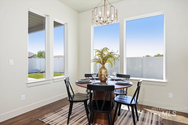 507 Falling Leaf Ln, Twin Falls, ID 83301 - dining space with a chandelier, healthy amount of natural light, and wood finished floors