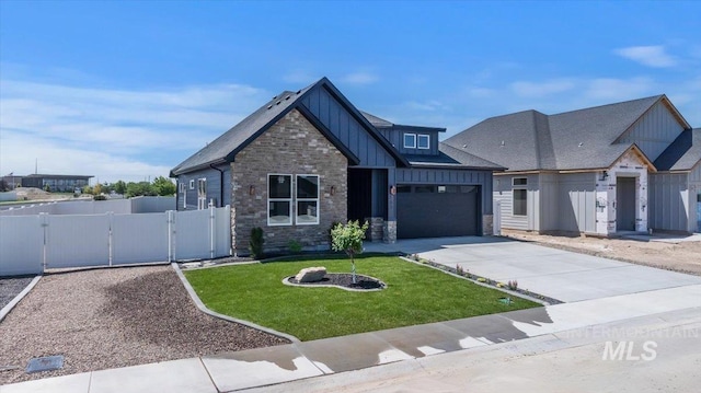 507 Falling Leaf Ln, Twin Falls, ID 83301 - view of front of home with board and batten siding, a gate, driveway, stone siding, and an attached garage