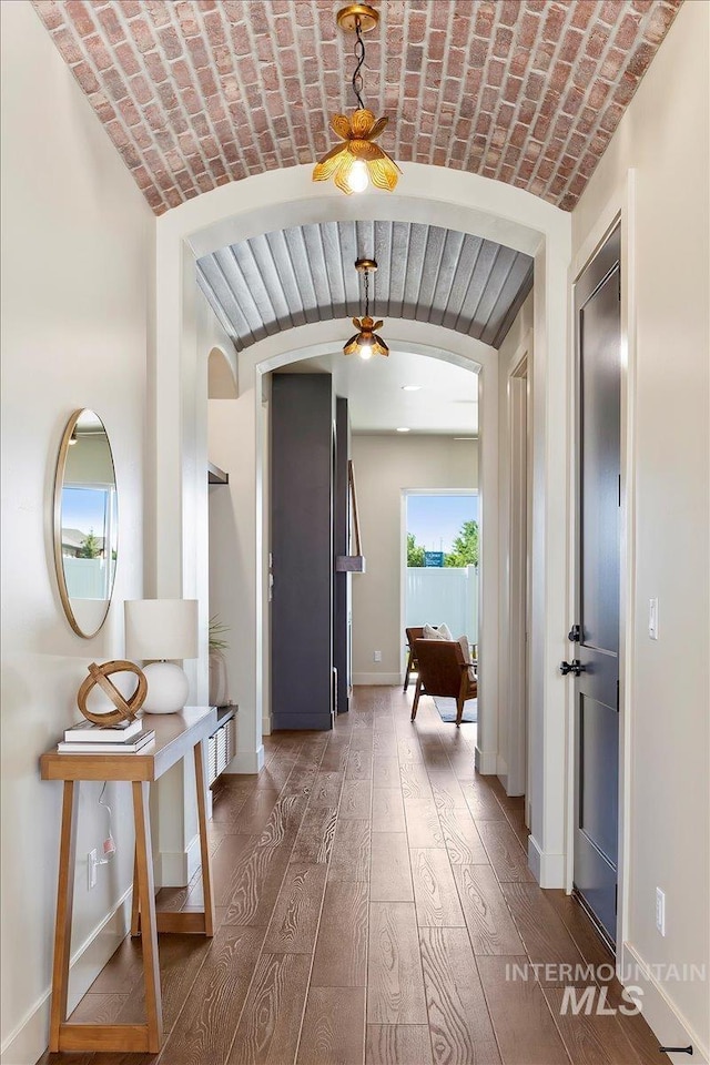 507 Falling Leaf Ln, Twin Falls, ID 83301 - corridor with arched walkways, wood-type flooring, and brick ceiling