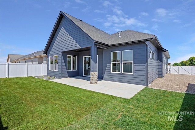 507 Falling Leaf Ln, Twin Falls, ID 83301 - rear view of property featuring a patio area, a fenced backyard, and roof with shingles