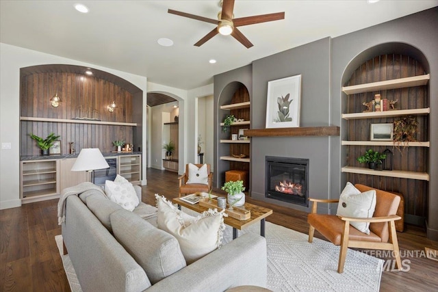 507 Falling Leaf Ln, Twin Falls, ID 83301 - living room featuring ceiling fan, built in shelves, wood finished floors, a glass covered fireplace, and recessed lighting
