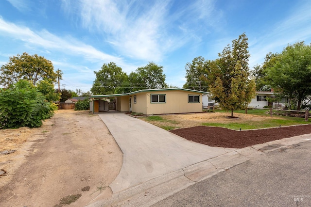 view of front of property featuring a carport