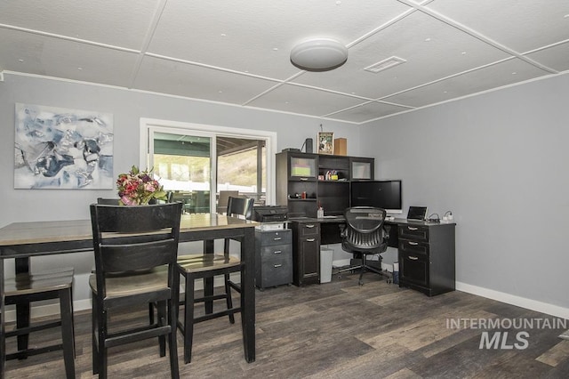 office featuring visible vents, baseboards, and dark wood finished floors