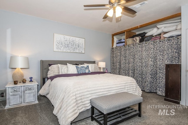 bedroom with carpet, visible vents, and a ceiling fan
