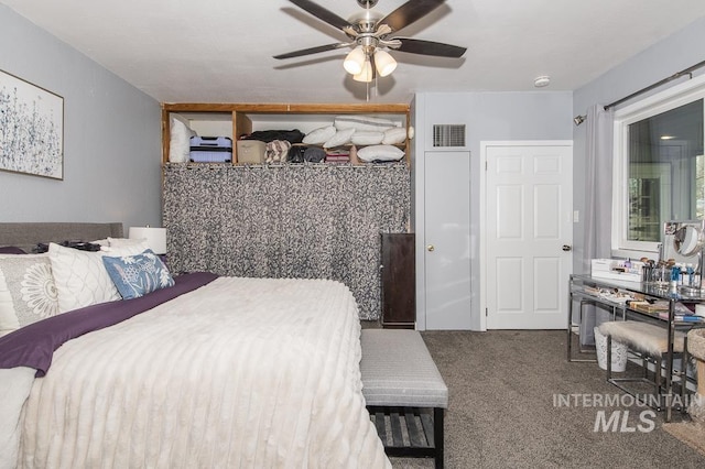 bedroom with visible vents, ceiling fan, and carpet flooring