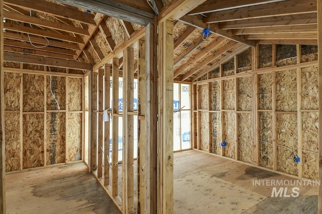 miscellaneous room with lofted ceiling