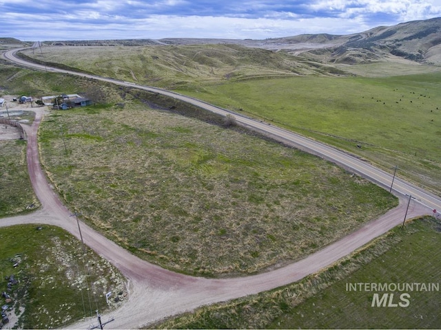 aerial view featuring a rural view and a mountain view