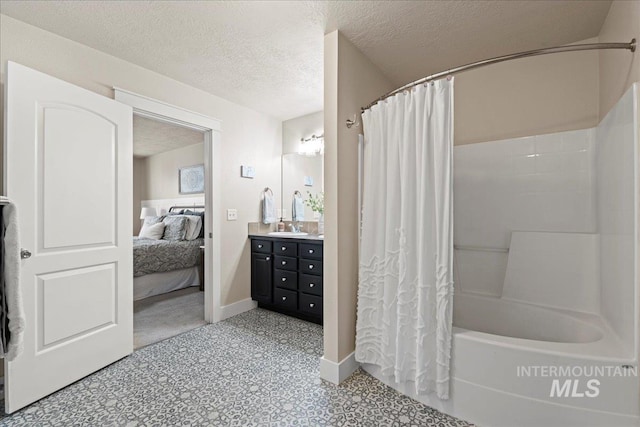 ensuite bathroom featuring vanity, shower / bathtub combination with curtain, baseboards, ensuite bathroom, and a textured ceiling