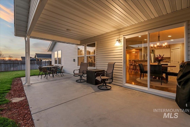 view of patio / terrace with outdoor dining area and fence