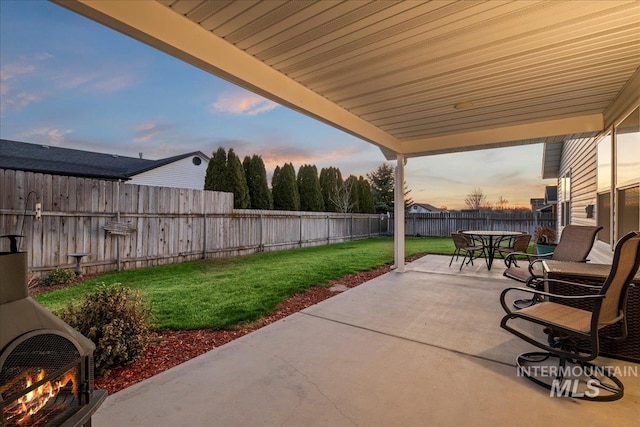 view of patio with outdoor dining area and a fenced backyard