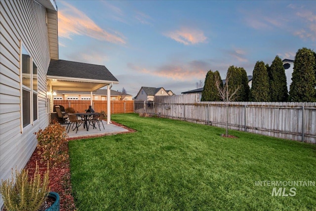 view of yard featuring a patio and a fenced backyard